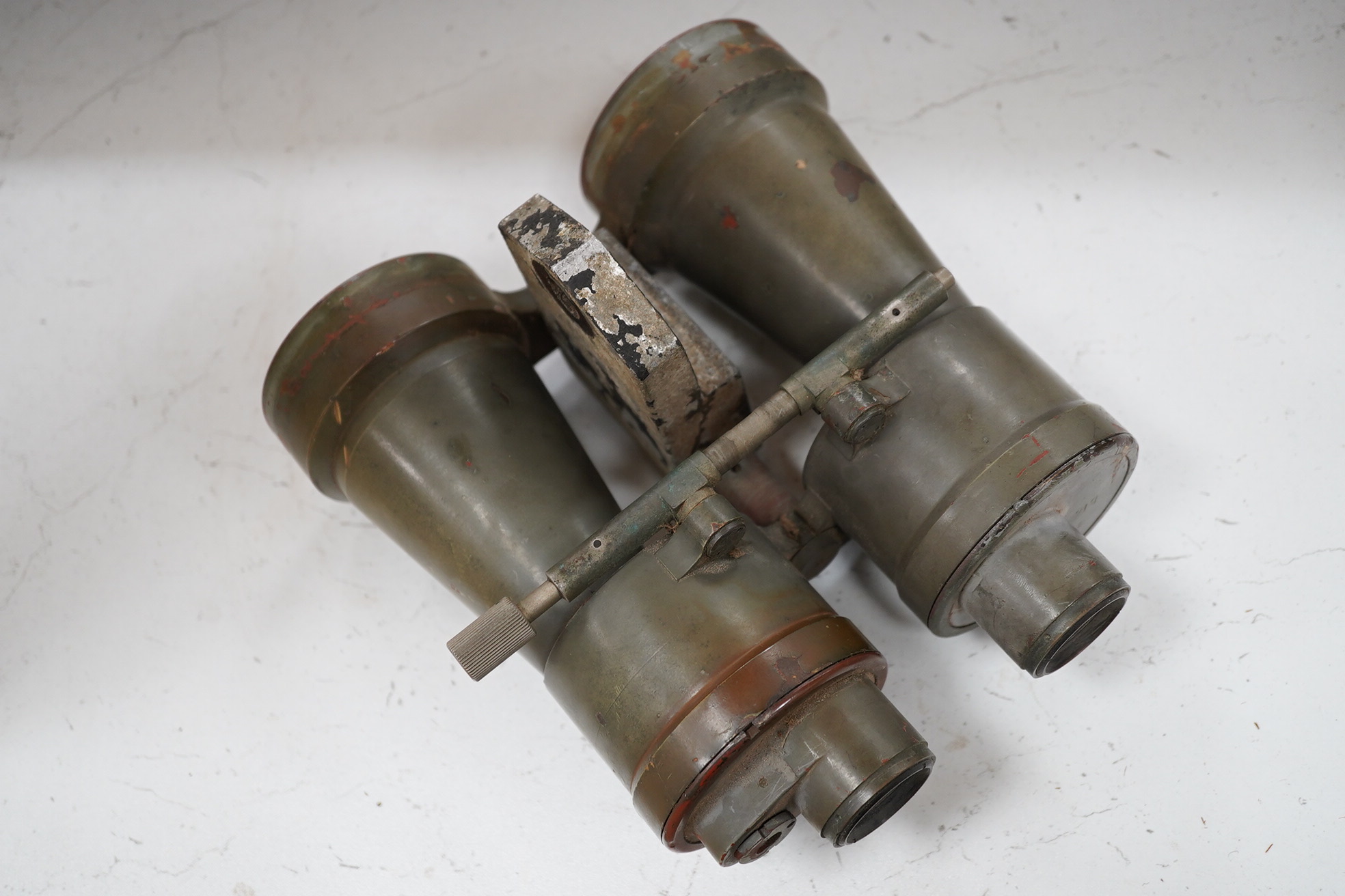 A pair of WWII German U boat coning tower binoculars stamped; U.D.F. 7x50 317971 blc, 20.5cm long. Condition - poor, all lenses damaged, one shattered, and general wear overall.